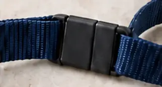 Black plastic safety break on a navy lanyard
